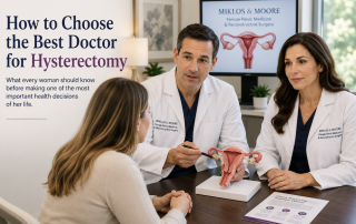 Dr. John Miklos and Dr. Robert Moore consulting with a woman about choosing the best doctor for a hysterectomy.